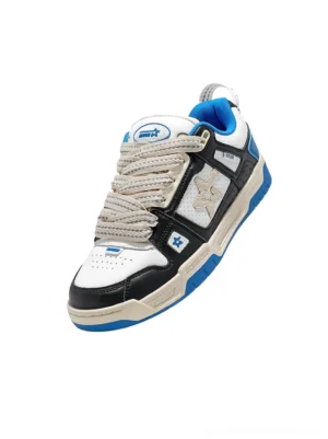 Single blue retro low-top casual sneaker in a three-quarter front view with royal blue lining, black overlays, cream midsole and layered streetwear construction