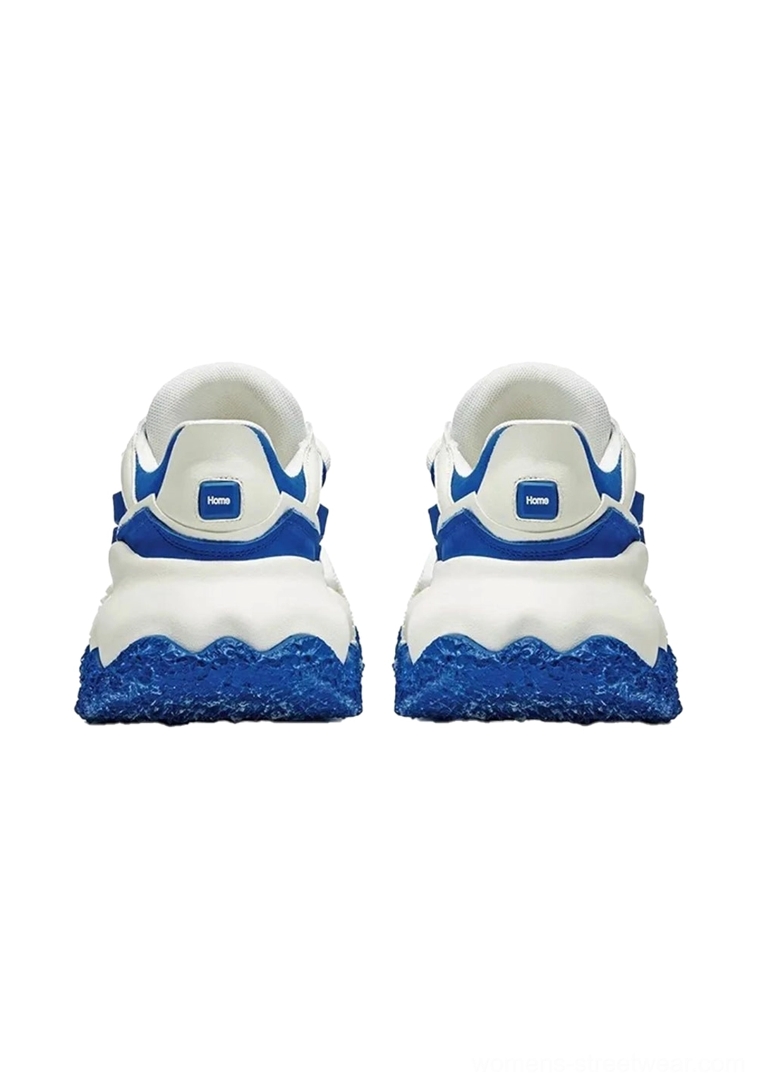 Rear view of pair of blue and white chunky sole colorblock sneakers showing branded heel tabs, layered panels, and distinctive speckled blue wavy outsole
