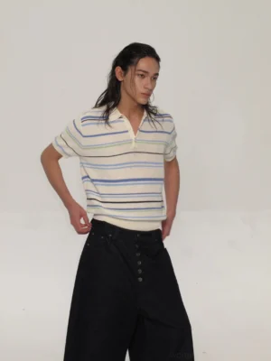 Three-quarter front view of a cream blue stripe openwork knit polo shirt with green and dark accents, relaxed short sleeves, polo collar, and semi-sheer streetwear texture