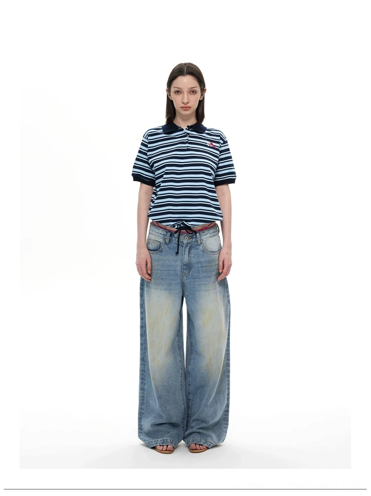 Blue striped retro polo shirt with navy ribbed collar and wide leg washed jeans full body outfit