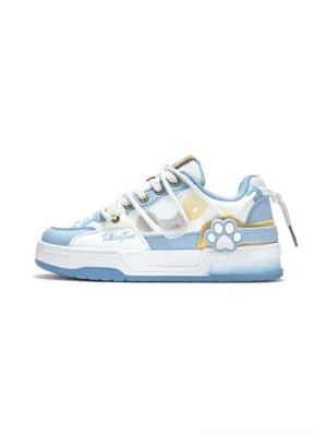Blue and white paw print low-top court sneakers with layered synthetic leather panels, gold trim and playful streetwear detailing