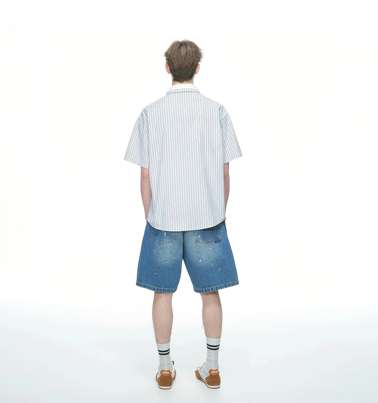 Back view of a blue and white pinstripe short sleeve button up shirt showing the consistent vertical stripe pattern and relaxed hem