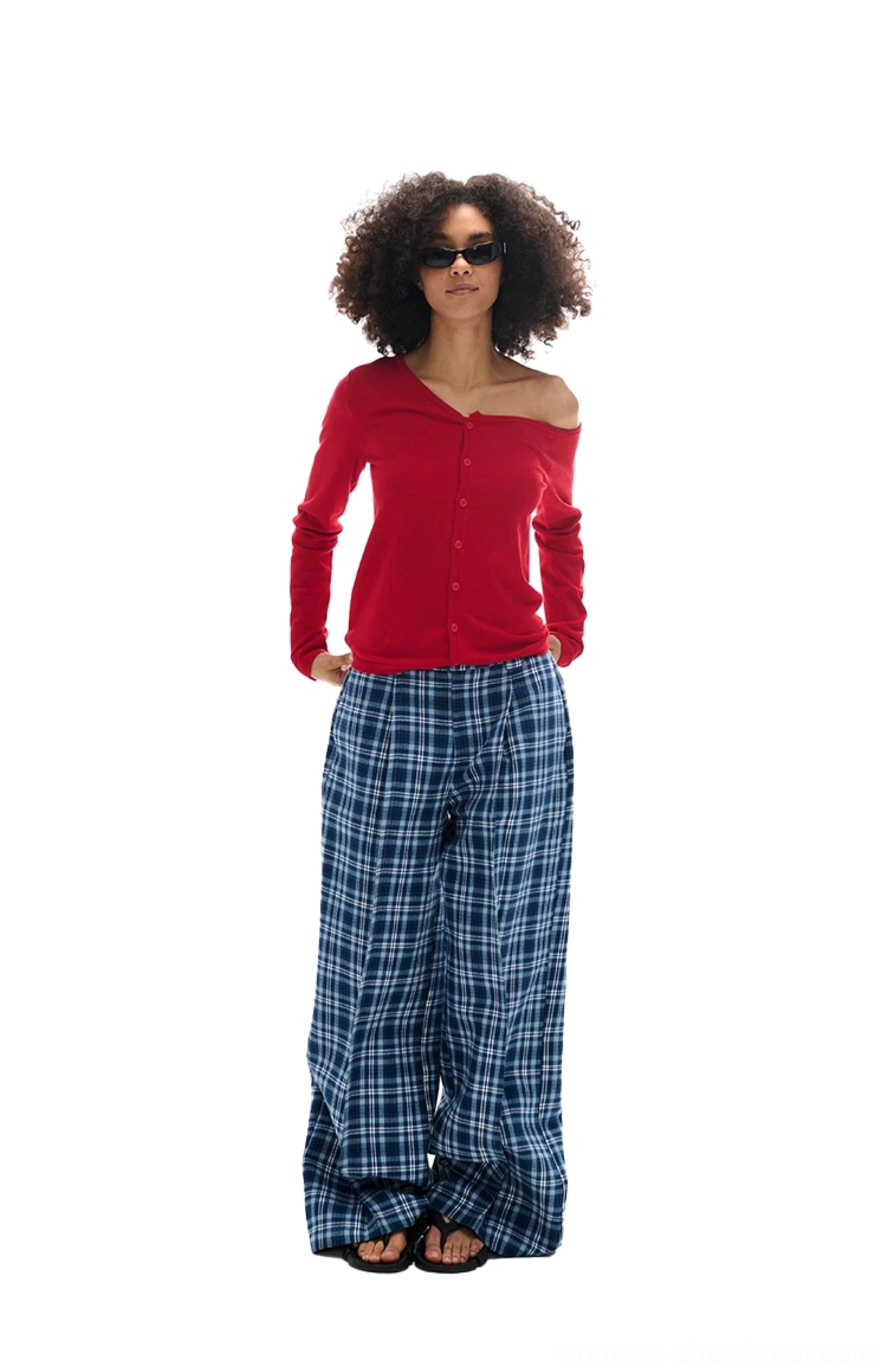 Front view of blue and white plaid high-waisted wide-leg casual pants styled with a red top and slide sandals