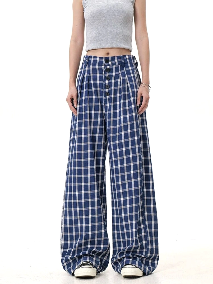 Blue and white plaid wide-leg pants styled with a cropped top in a clean studio full-body fashion view