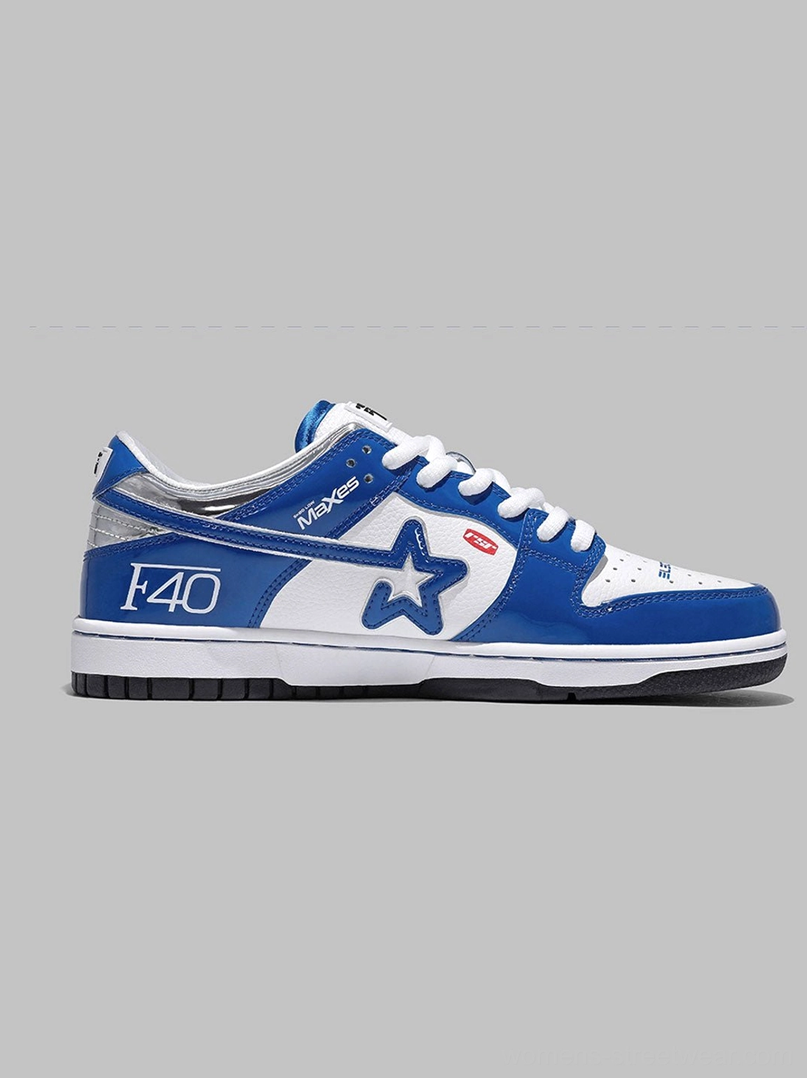 Right side view of a blue and white retro racing sneaker with star logo, F40 graphic, glossy upper, and silver heel side accent