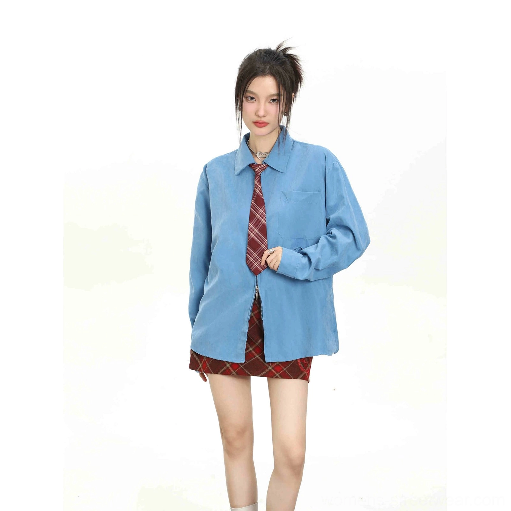 Blue women's long sleeve shirt styled with a red plaid tie and matching plaid mini skirt