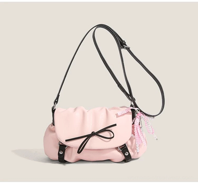 Blush pink Y2K ruched flap shoulder satchel with double black straps front bow and side ribbon pendant