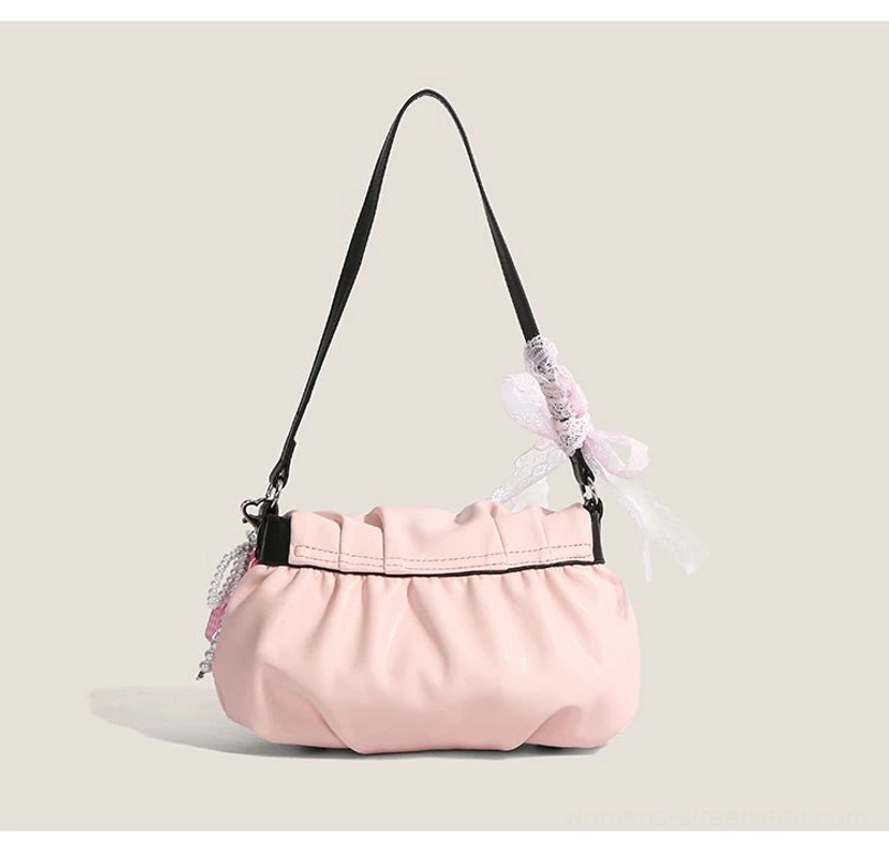 Plain blush pink ruched shoulder bag with gathered PU body black shoulder strap and lace ribbon charm