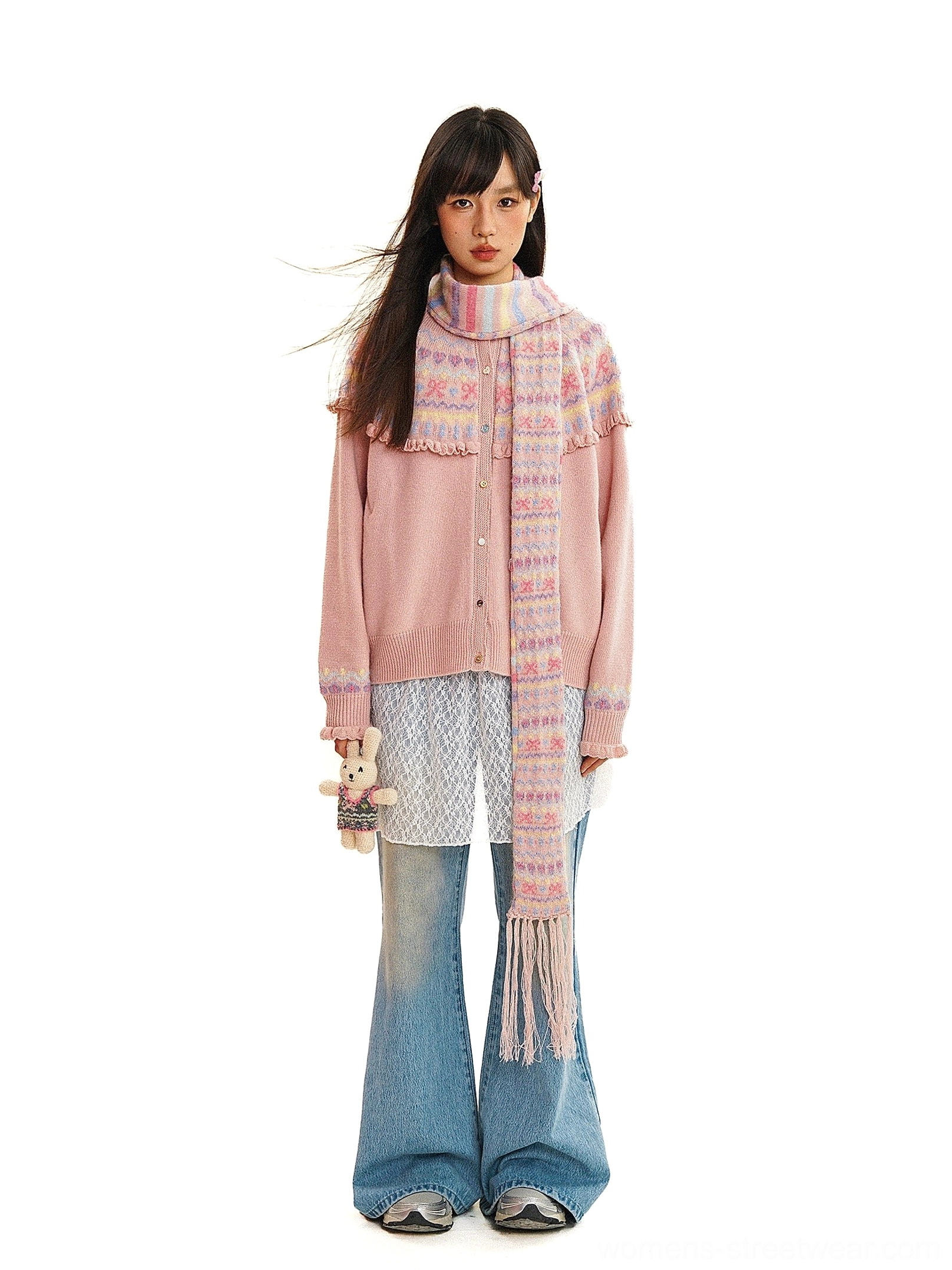 Blush pink Fair Isle knit cardigan with decorative yoke pattern and matching long tassel scarf styled with flared jeans