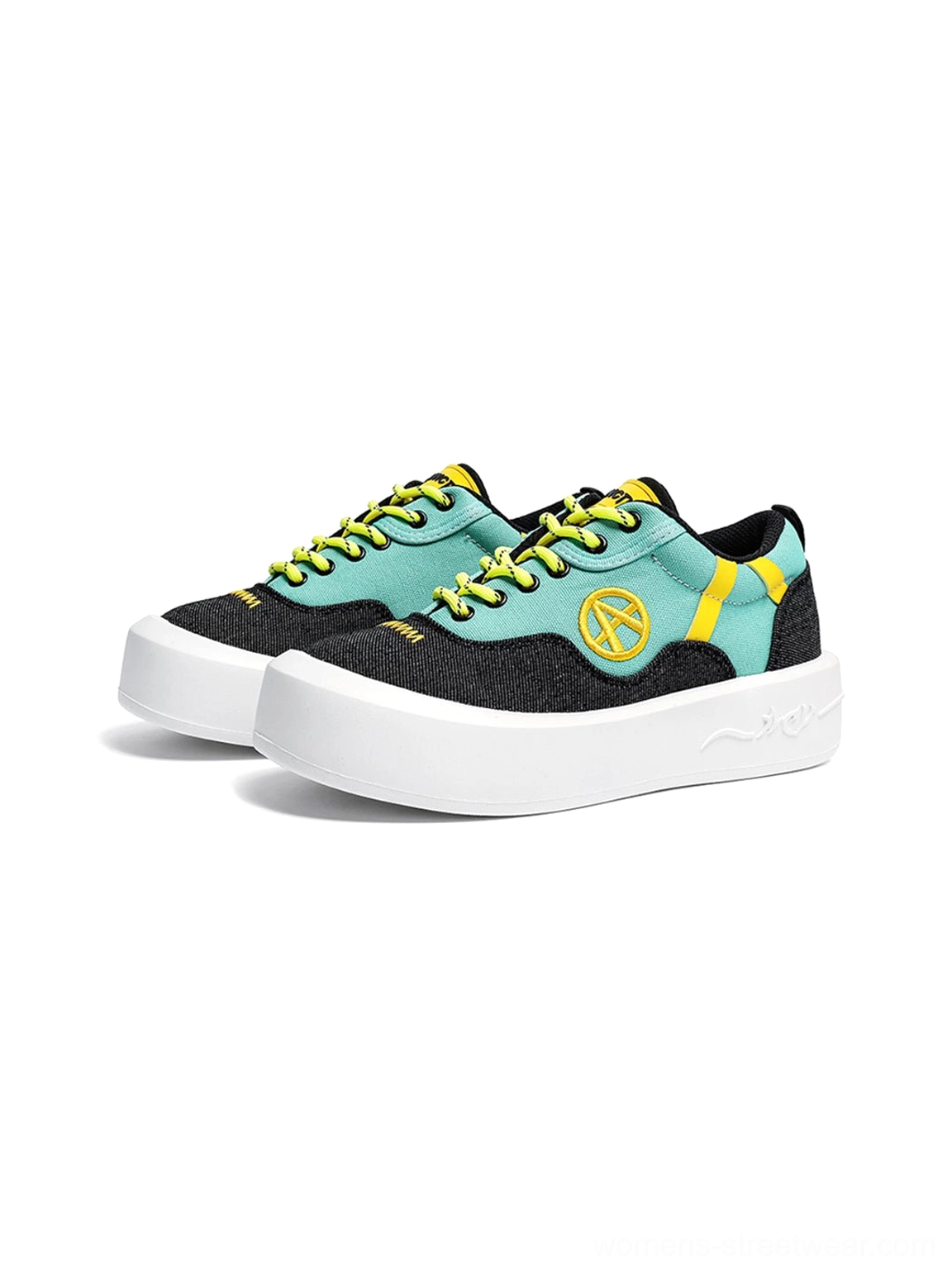 Bold neon platform sneakers combining playful color blocking with a classic low-top streetwear silhouette
