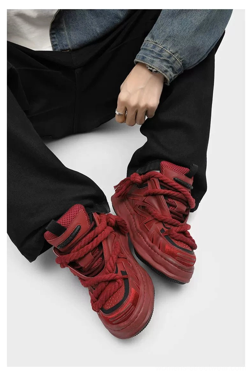 Bold streetwear chunky sneakers with oversized braided laces, layered geometric paneling, thick textured traction outsole, and a contemporary Seoul fashion aesthetic