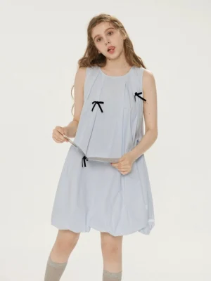 Front view of a light blue bow detail bubble hem sleeveless summer dress with crew neck and pleated bodice