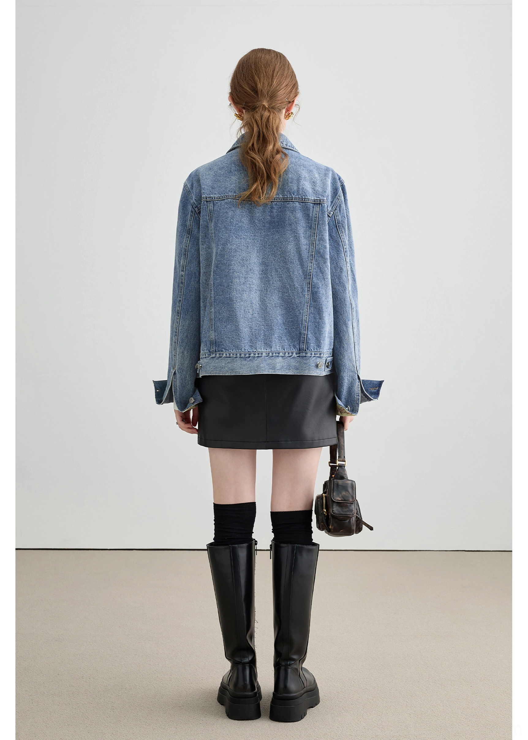 Relaxed boxy denim jacket with turn-back embroidered cuffs designed for Korean fashion layering
