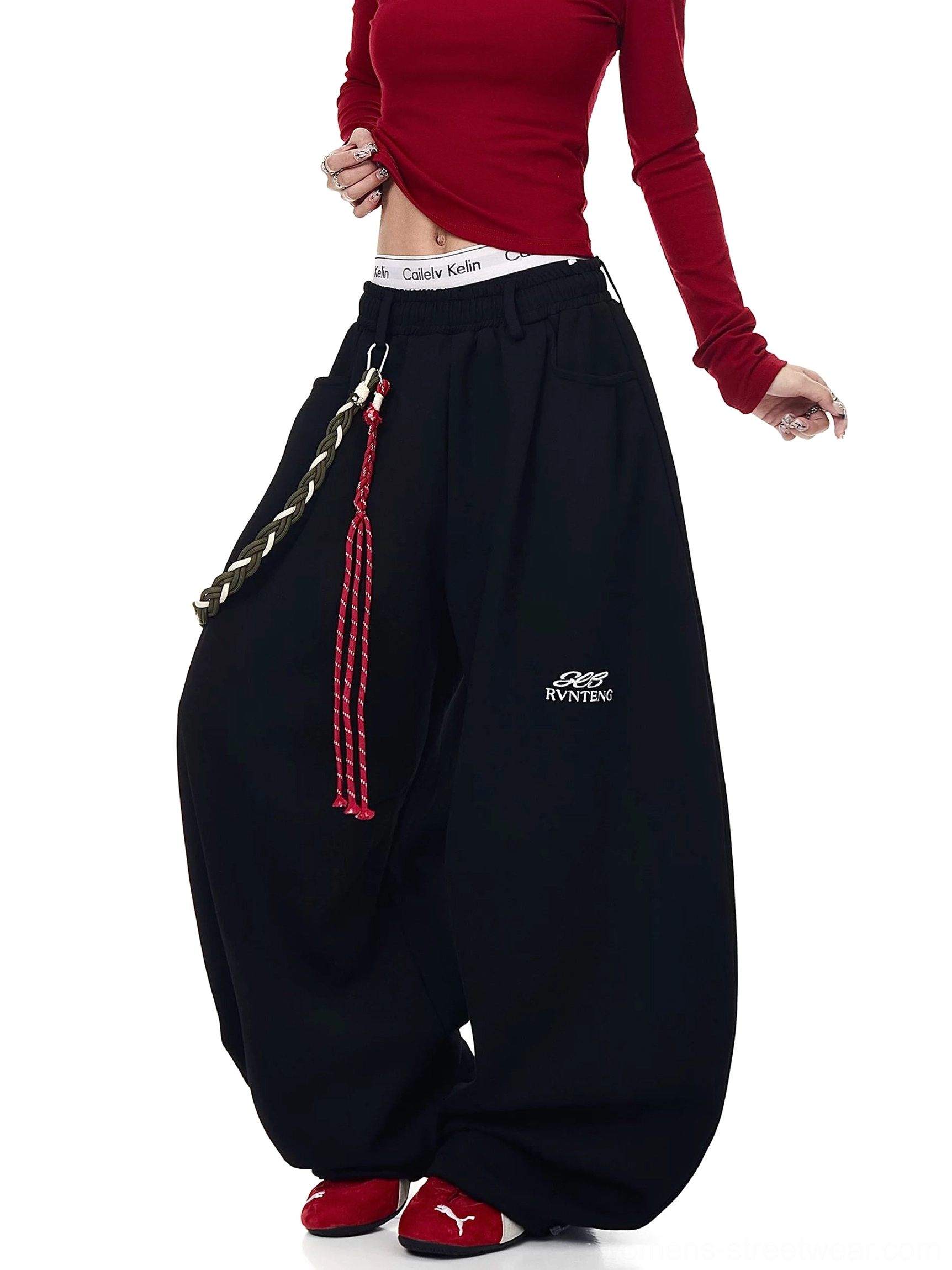 Black braided rope ultra-wide fleece track pants with elastic logo waistband shown with cropped red long-sleeve top