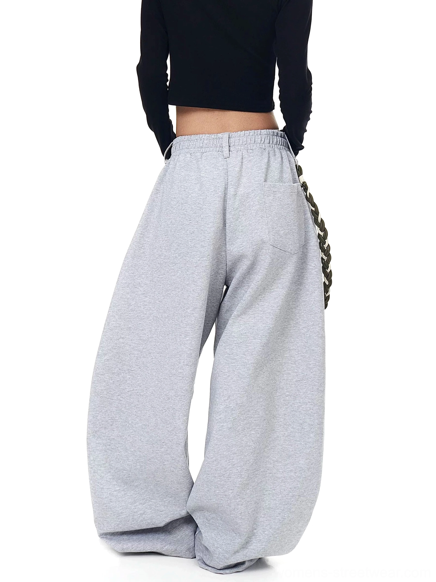 Back view of heather gray braided rope ultra-wide fleece streetwear track pants with elastic lettered waistband