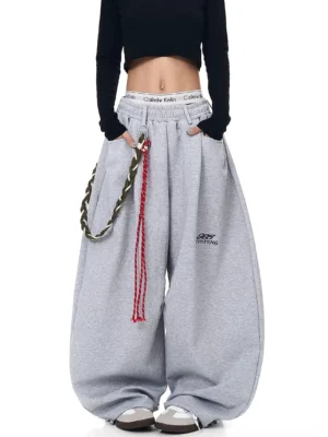Heather gray braided rope ultra-wide fleece streetwear track pants front full-body view with cropped black top