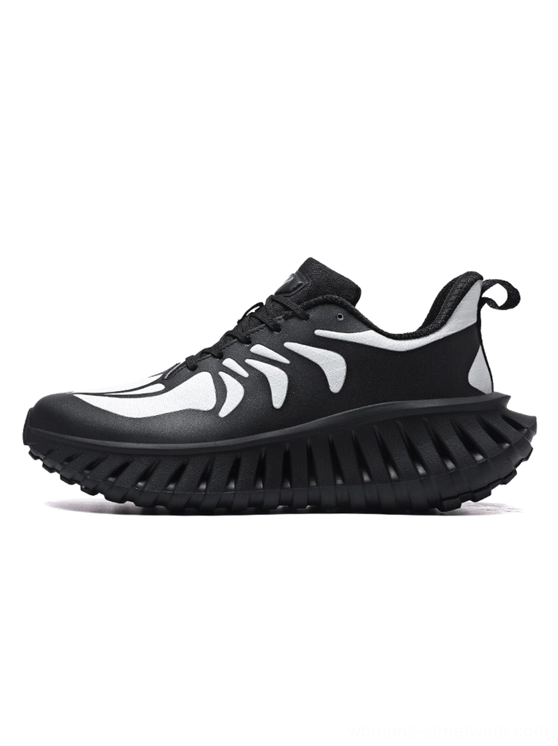 Black and white colorblock running sneakers with bold skeletal-style upper pattern, lace-up fastening, rear pull tab, and thick black outsole