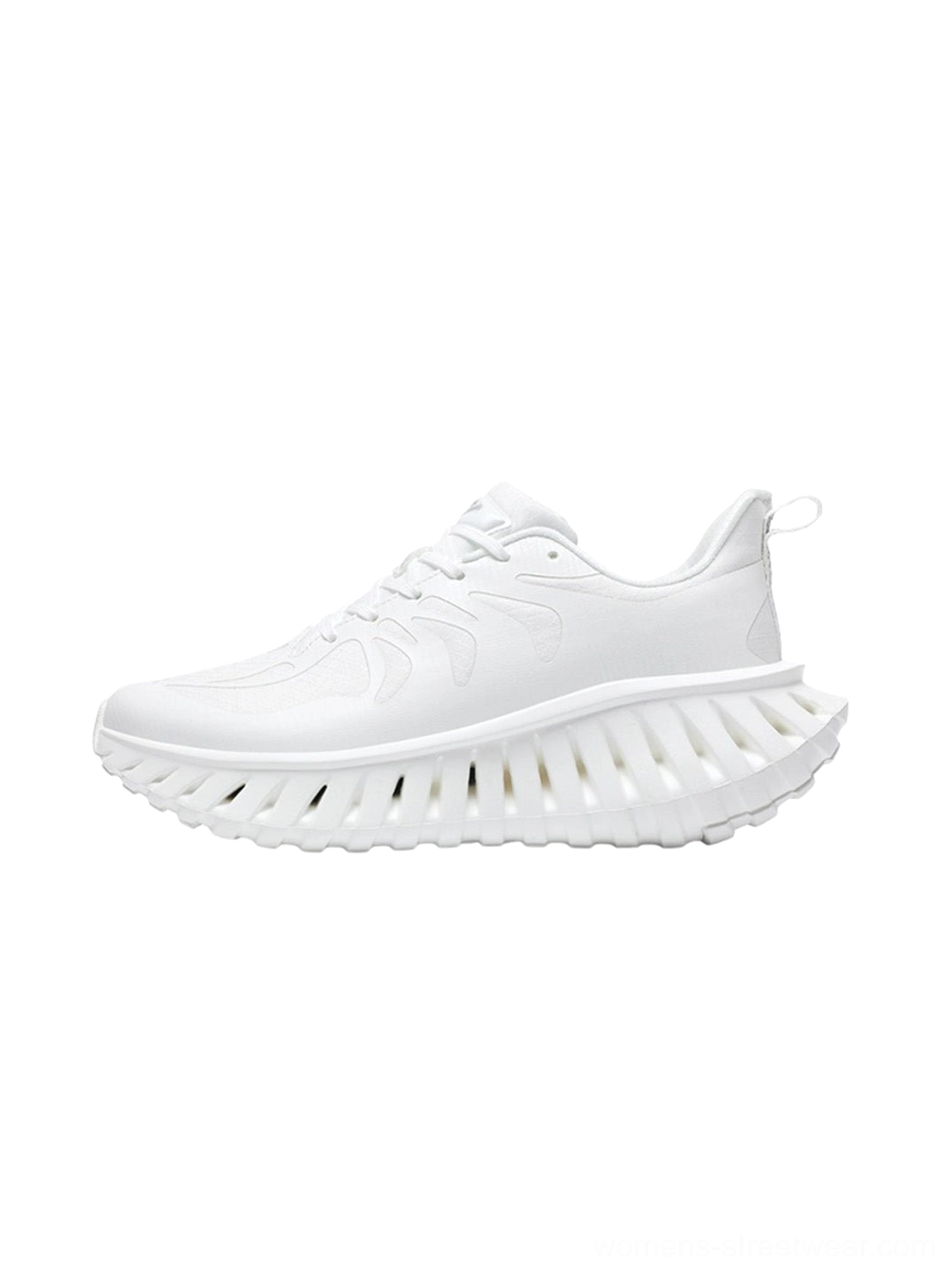 White colorblock running sneakers with breathable athletic styling, lace-up closure, cushioned low-top shape, and textured streetwear outsole