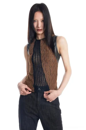 Close-up of brown black fitted tank top showing asymmetrical sheer lace panel and contrasting faux leather trim