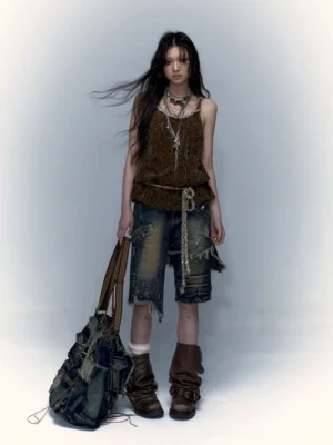 Brown crochet lace camisole tank top back three-quarter streetwear outfit with distressed denim shorts and brown boots