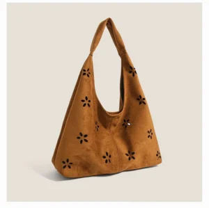 Brown daisy cutout suede-effect hobo tote bag with wide shoulder strap front studio view