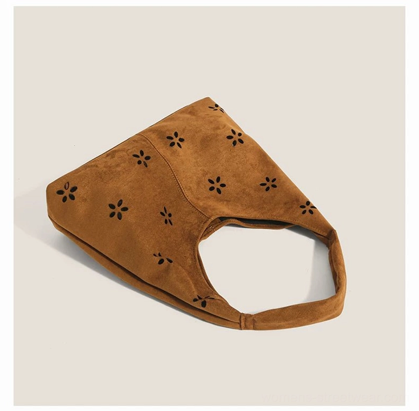 Brown daisy cutout suede-effect hobo tote bag open top and flat bottom overhead view