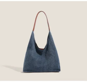 Brown denim hobo shoulder bag with relaxed triangular silhouette and contrast brown strap for Korean streetwear