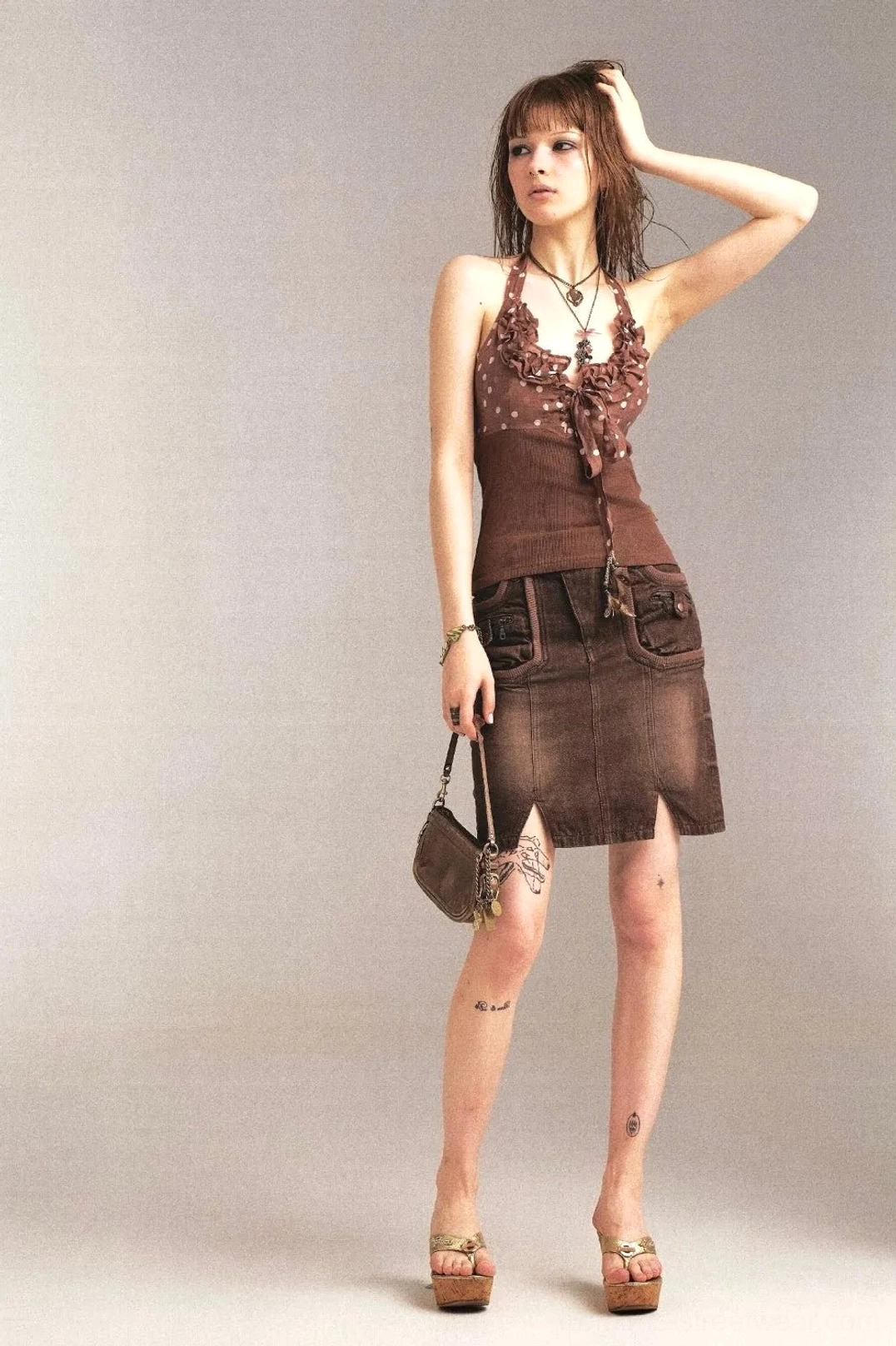 Front side outfit view of brown denim pencil mini skirt with fitted silhouette and front slit