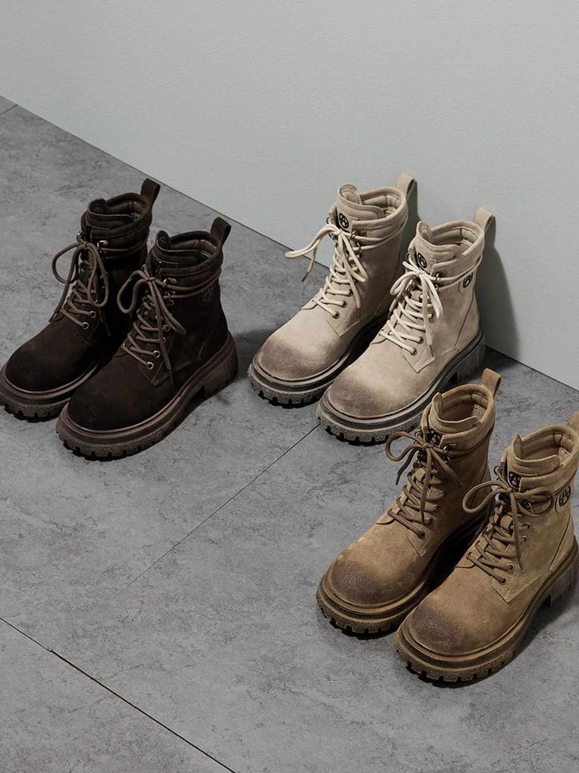 Pair of brown distressed platform combat boots displayed on lifestyle background showing versatile styling options streetwear aesthetic