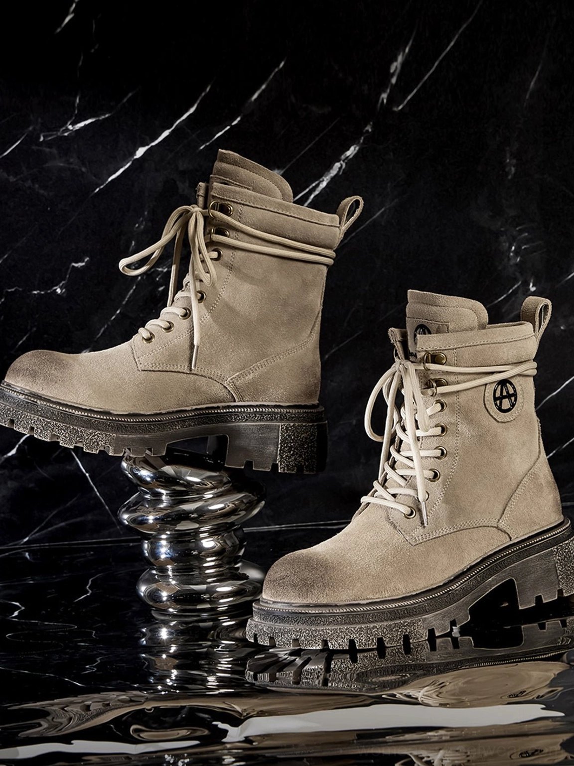 Distressed platform combat boots in brown color showing wraparound welt construction ankle patch logo detailed craftsmanship
