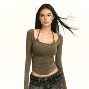 Brown double strap scoop neck fitted long sleeve top with layered halter neckline styled with dark low-rise jeans