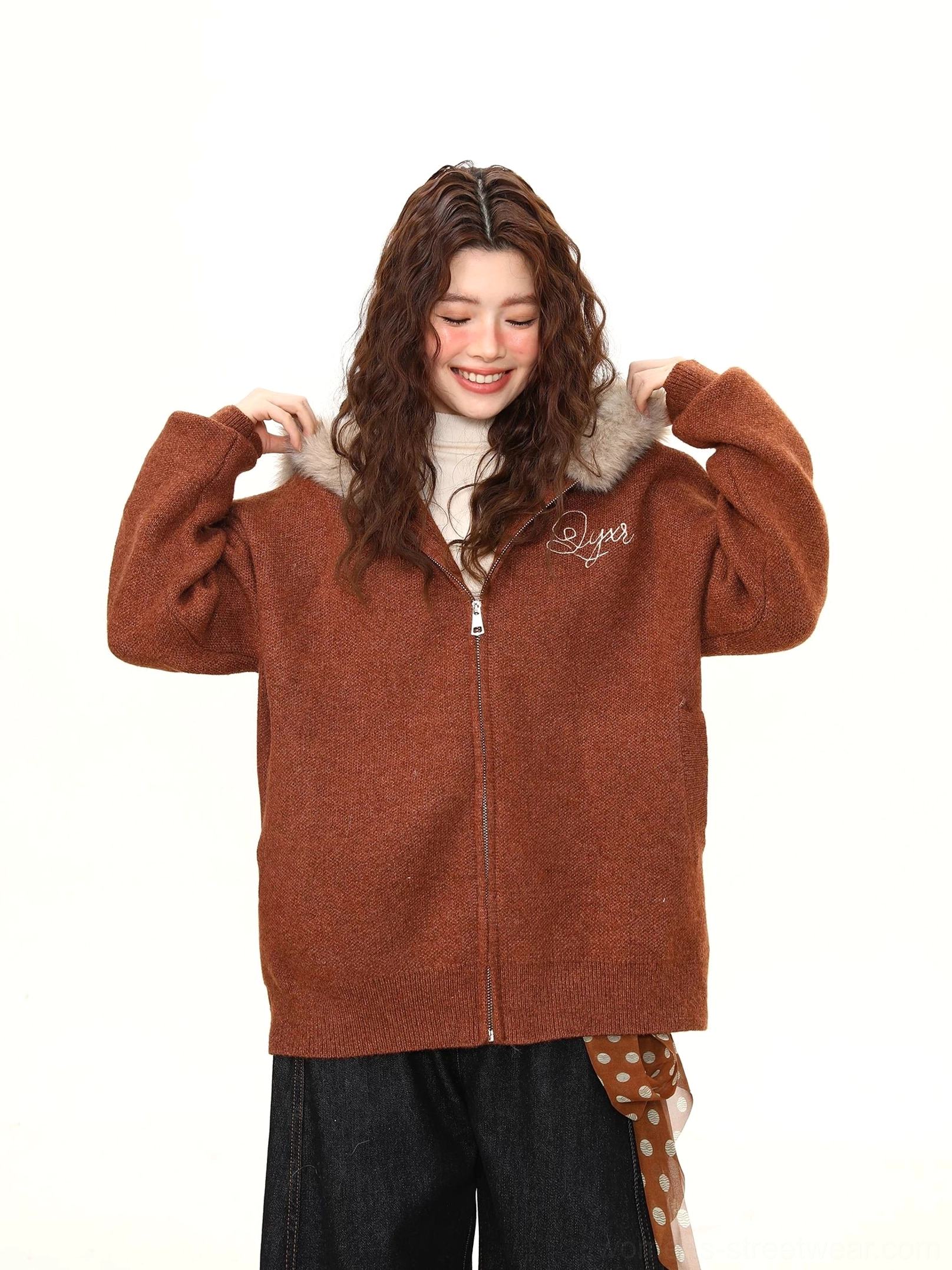 Front detail view of a women’s brown drop-shoulder teddy jacket showing the oversized sleeve shape and plush hood trim