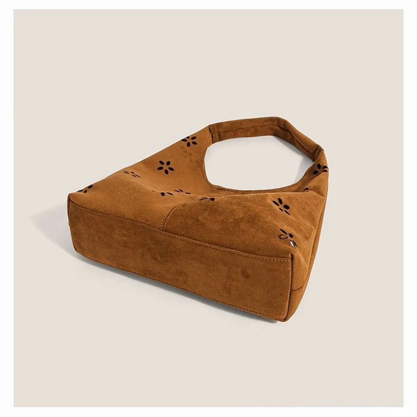 Brown floral cutout suede-effect hobo tote bag rear three-quarter view with wide strap