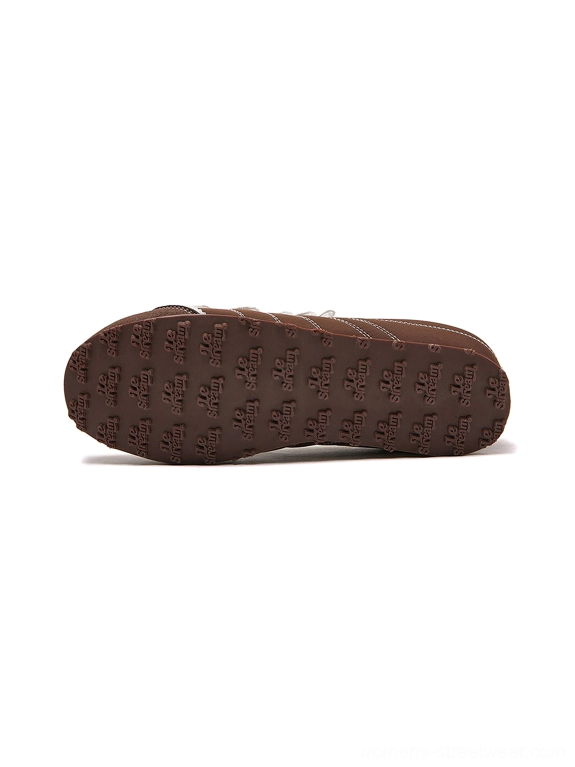 Brown frilled trainer sneakers detail view showing the retro low-top shape ruffled lace panel contrast stitching and white sole