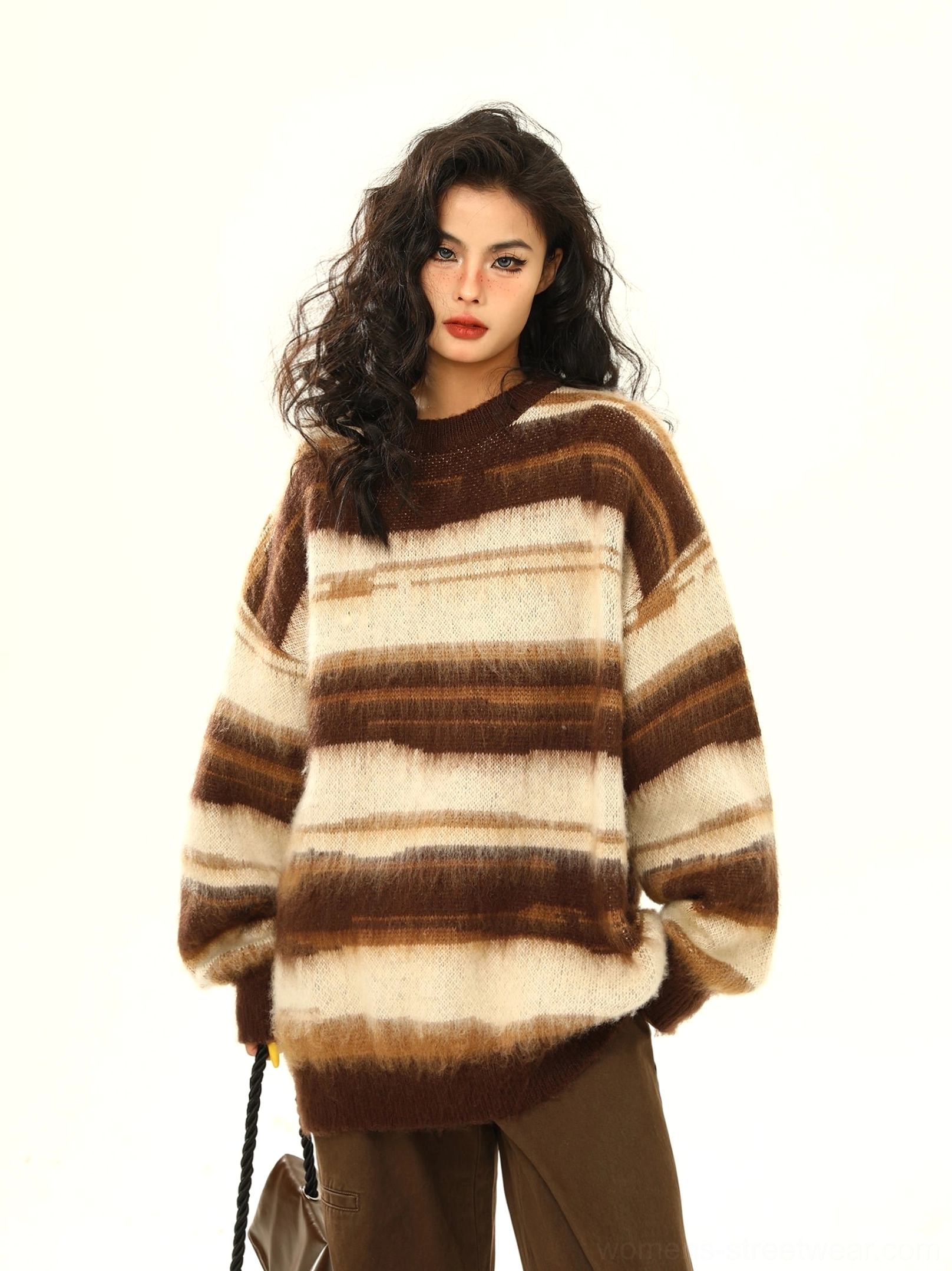 Brown fuzzy gradient stripe oversized crewneck knit sweater front view with brown loose fit trousers