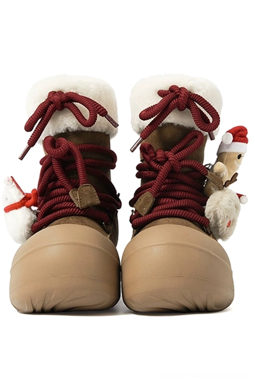 Brown gingerbread charm platform snow boots front view with tan rubber toe caps white fluffy cuffs burgundy rope laces and chunky soles