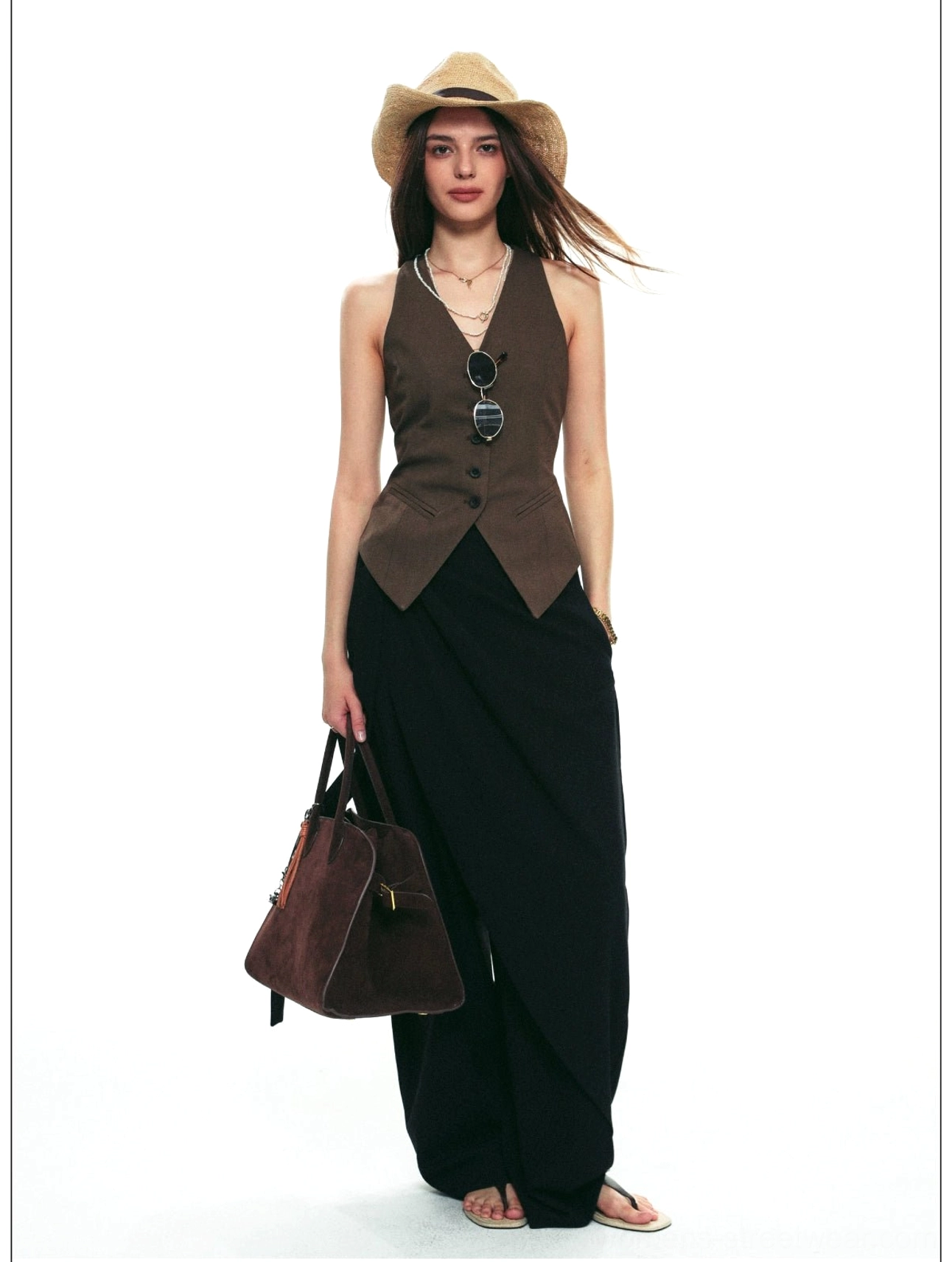 Brown halter vest styled with black wide-leg trousers, front buttons, round sunglasses, and modern streetwear accessories