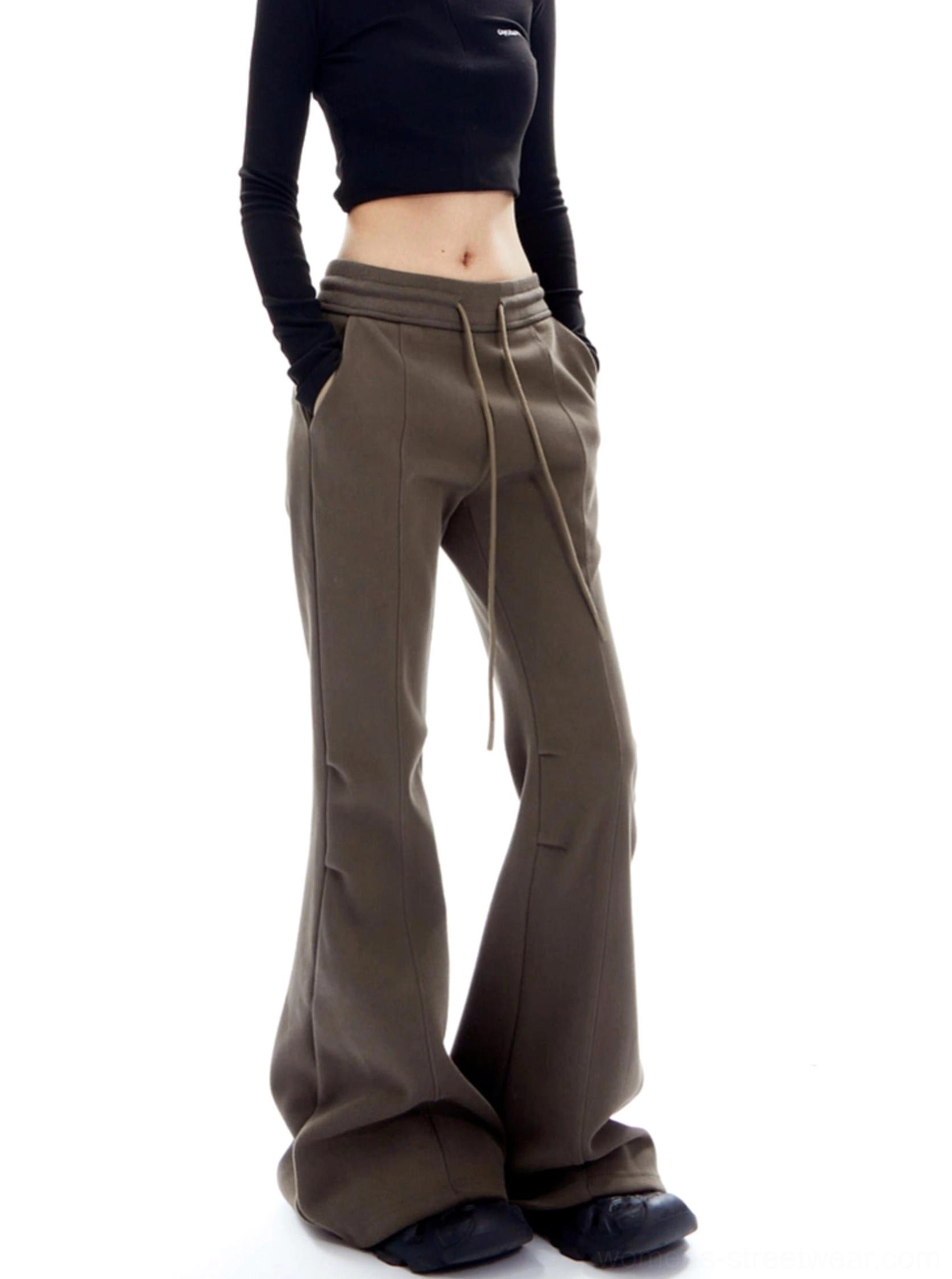 Three-quarter view of brown high-waisted flared lounge trousers with floor-length hem and relaxed Korean streetwear styling