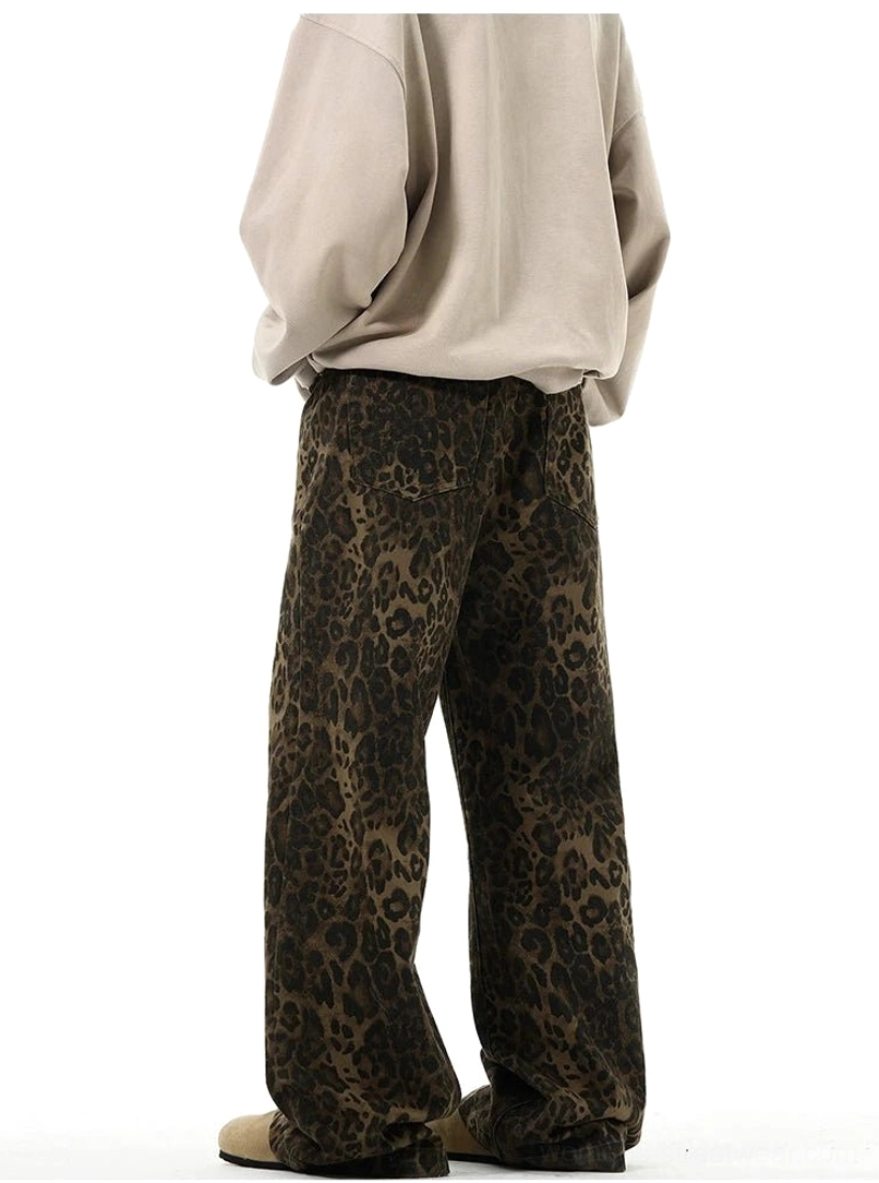 Rear side view of brown leopard print high-waist wide-leg trousers showing full-length drape and hem