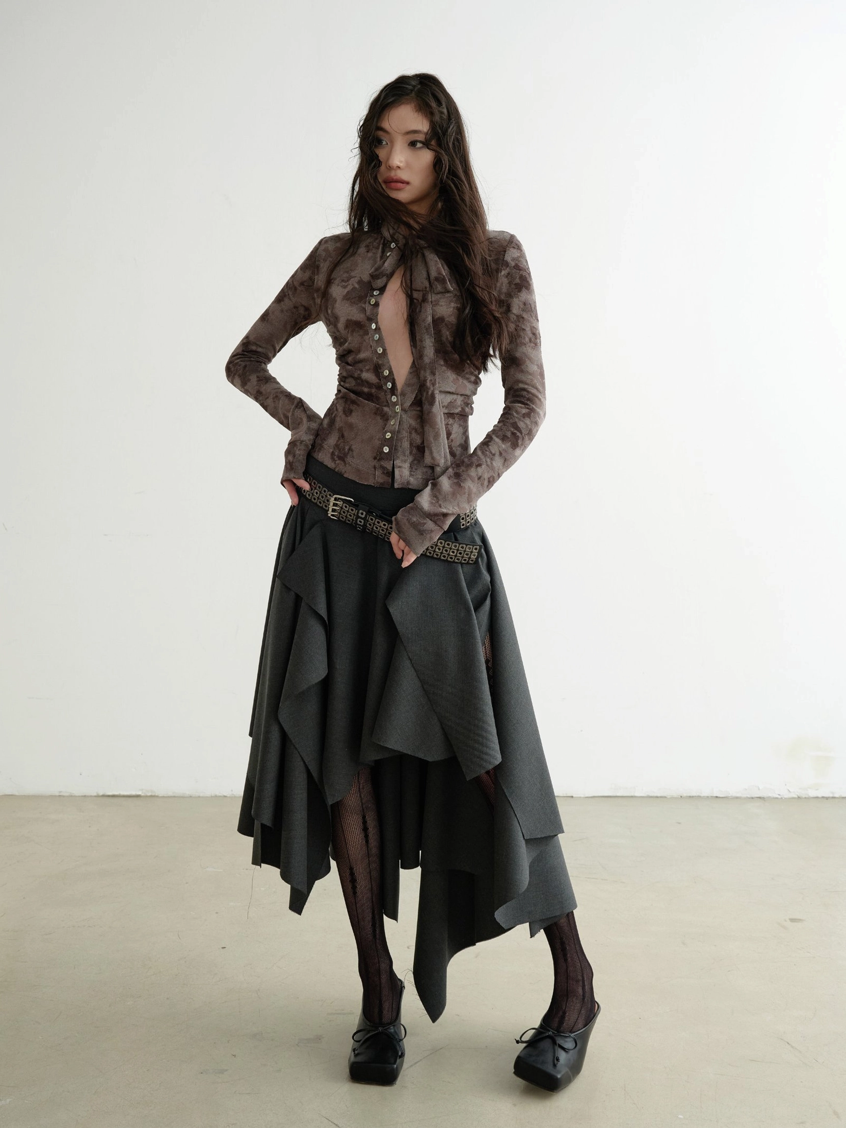 Side three-quarter view of brown marble print slim fit shirt with adjustable waist tie