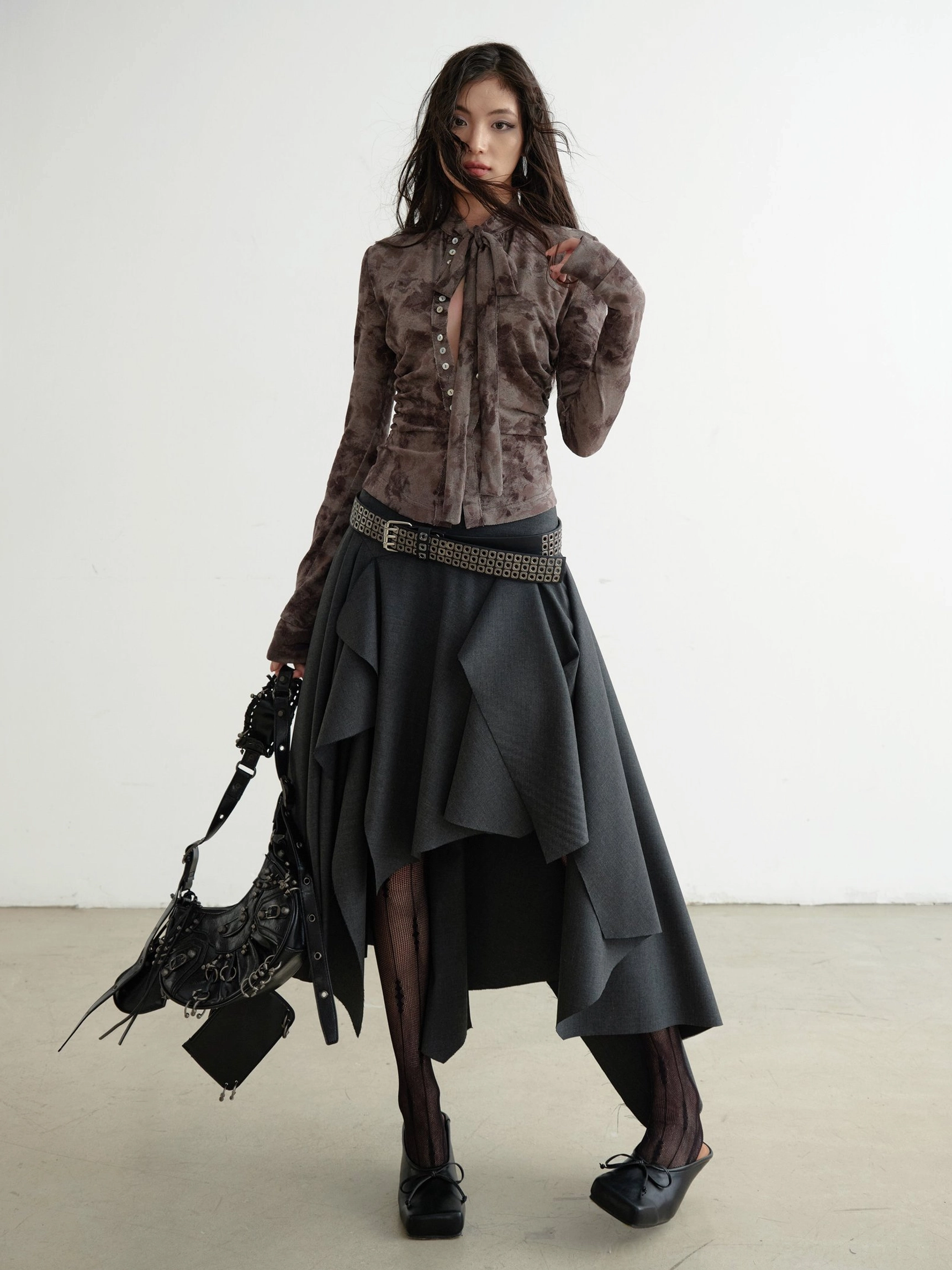 Brown marble print slim fit shirt styled with asymmetrical skirt and studded belt