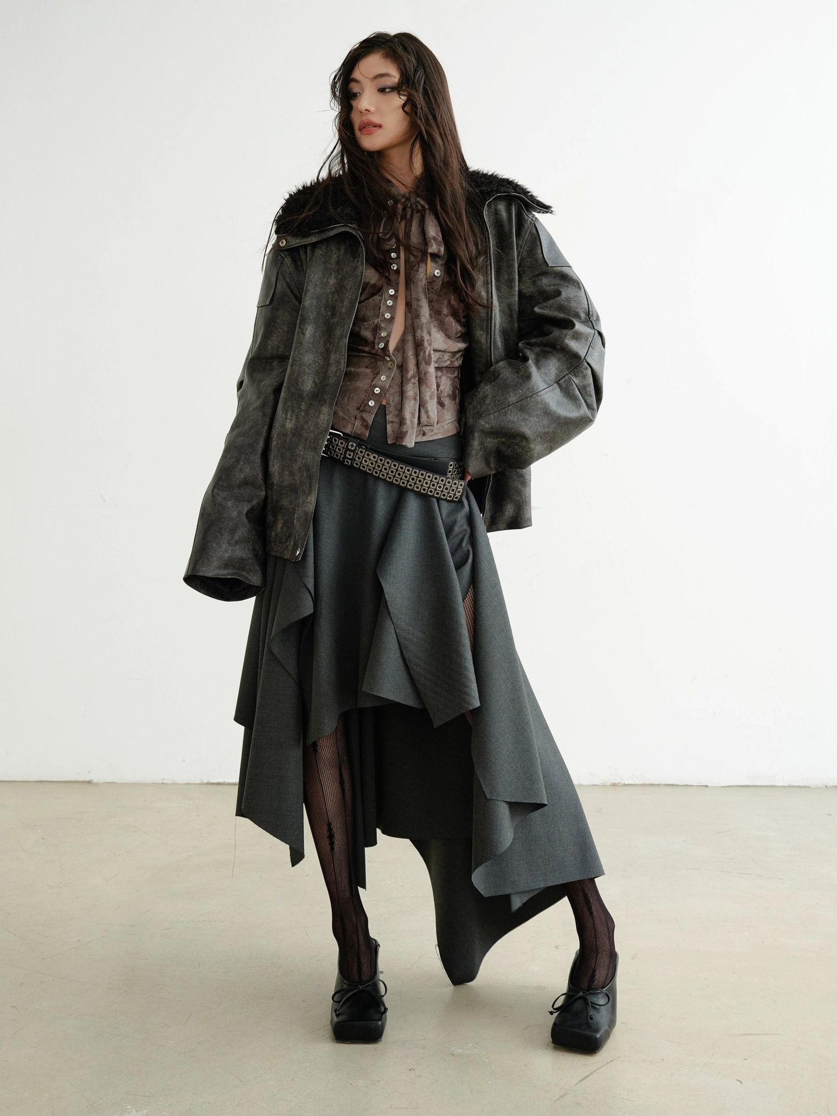 Brown marble print slim fit shirt under leather jacket with asymmetric skirt streetwear styling