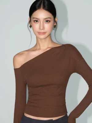 Brown marled knit asymmetric one-shoulder fitted tee with cropped hem and long sleeve in a three-quarter fashion view