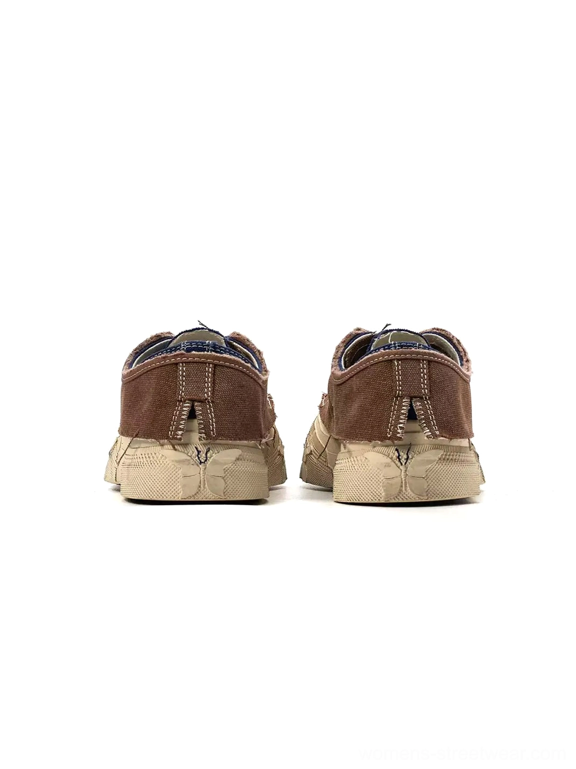 Rear view of brown and off-white distressed platform sneakers showing the structured heel design
