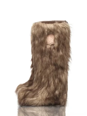 Brown ombre faux-fur knee-high boots shown in a frontal product view with plush gradient texture, rounded toe, sculpted low heel, and tall streetwear silhouette