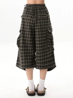 Rear view of brown plaid cargo culotte shorts showing elastic back waistband, relaxed cropped silhouette, side pockets, and back pockets