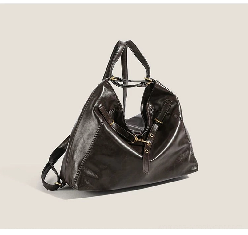 Brown polished PU leather-look hobo bag shown from the left side with convertible shoulder and crossbody strap system and vintage gold hardware accents