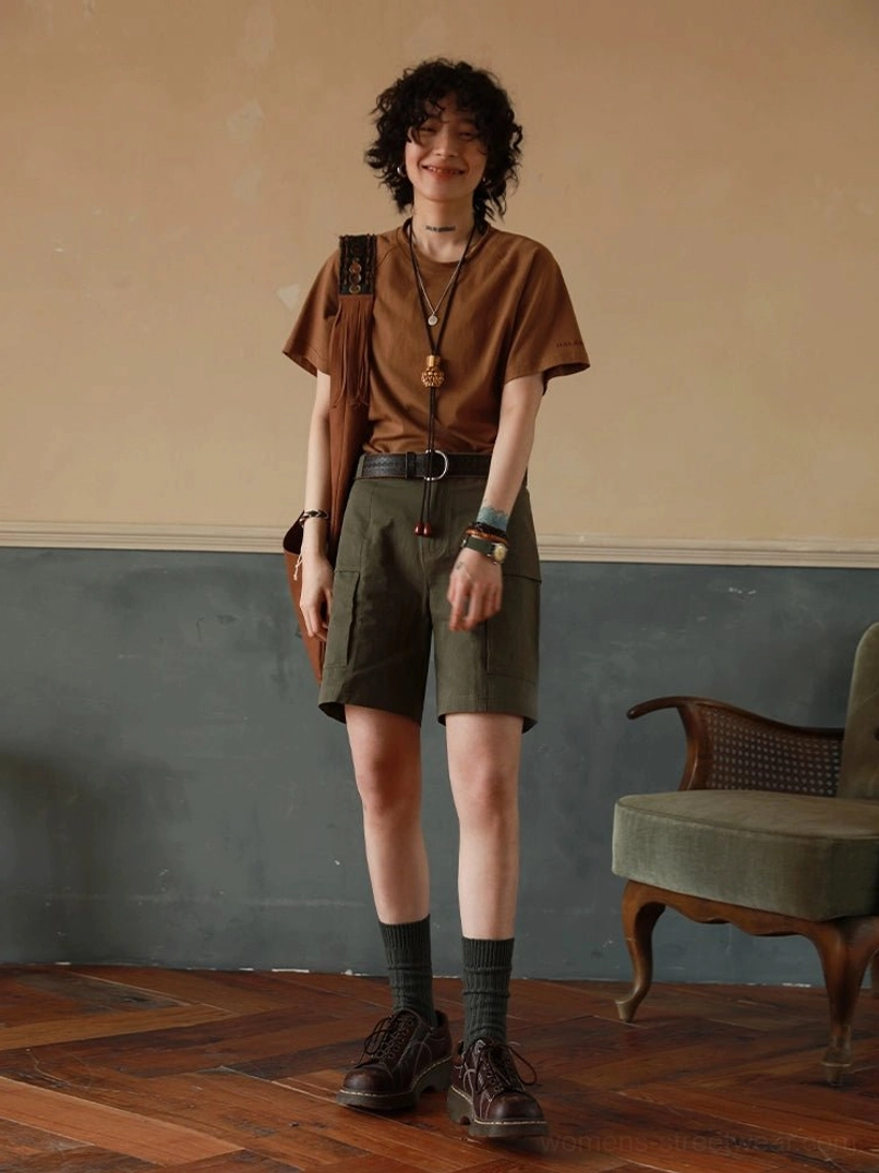 Warm brown raglan crew neck t-shirt full body casual look with green cargo shorts and leather belt, relaxed streetwear ensemble