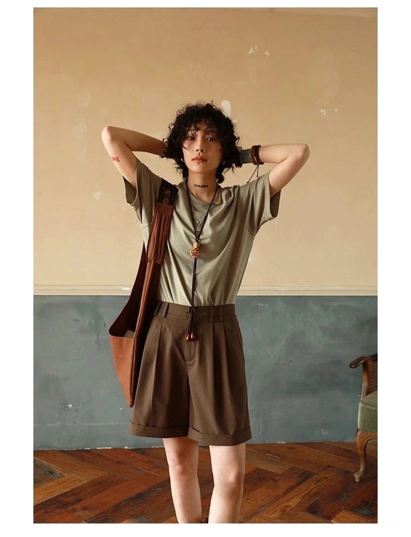 Brown raglan sleeve t-shirt displaying shoulder overlap construction and boxy loose fit silhouette profile
