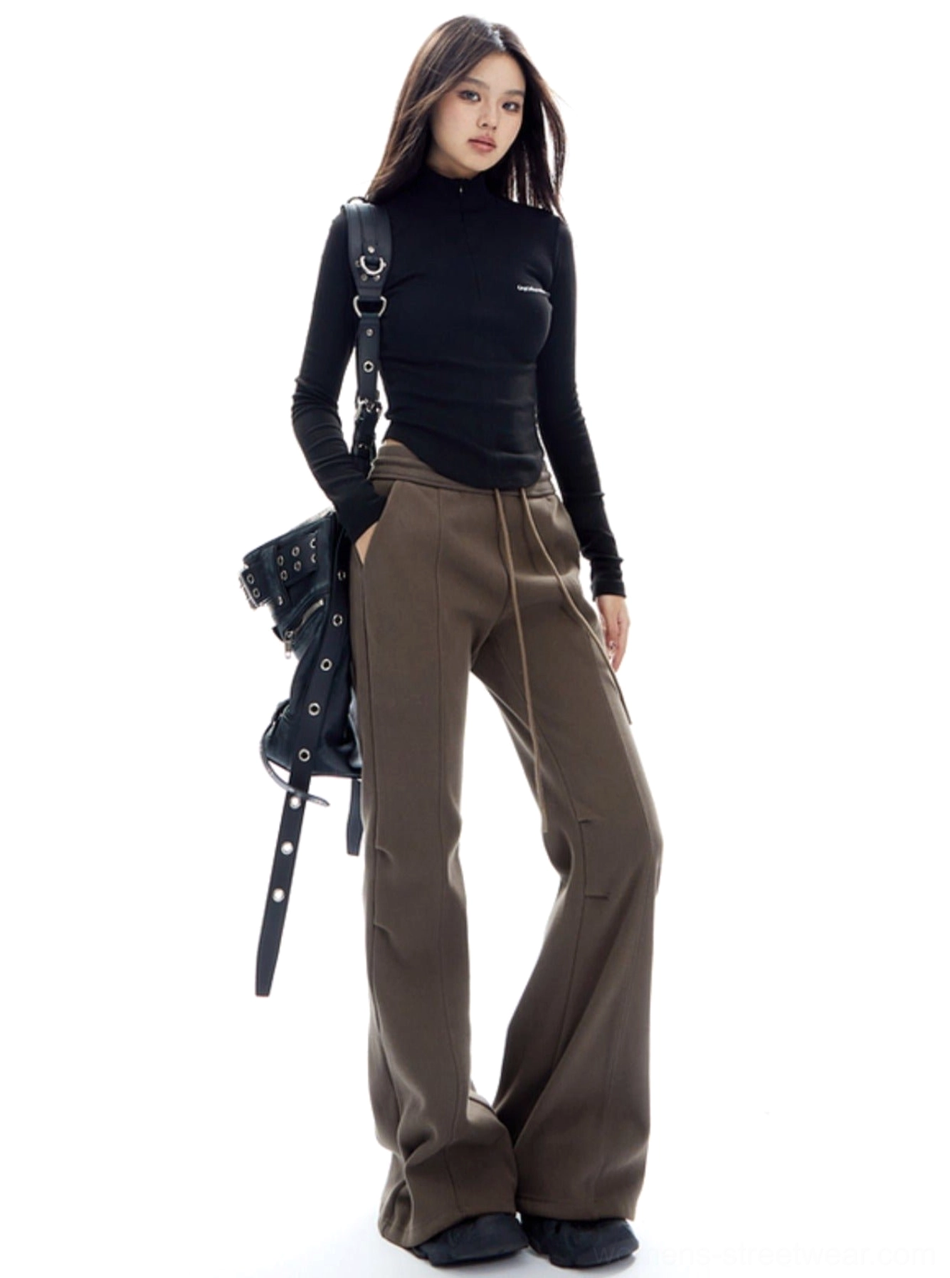 Side view of relaxed brown flared lounge pants with wide legs and casual Seoul-inspired streetwear outfit